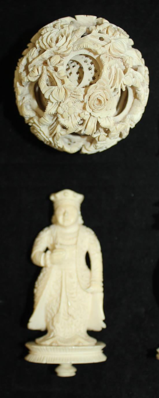 A Chinese export ivory puzzle ball and stand and four similar ivory chess pieces, 19th / early 20th century, 6.5cm - 21cm